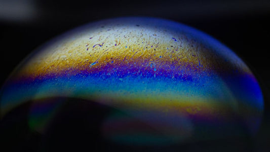 Zircon's Rainbow Surface: How Primary and Secondary Origins Affect Iridescence