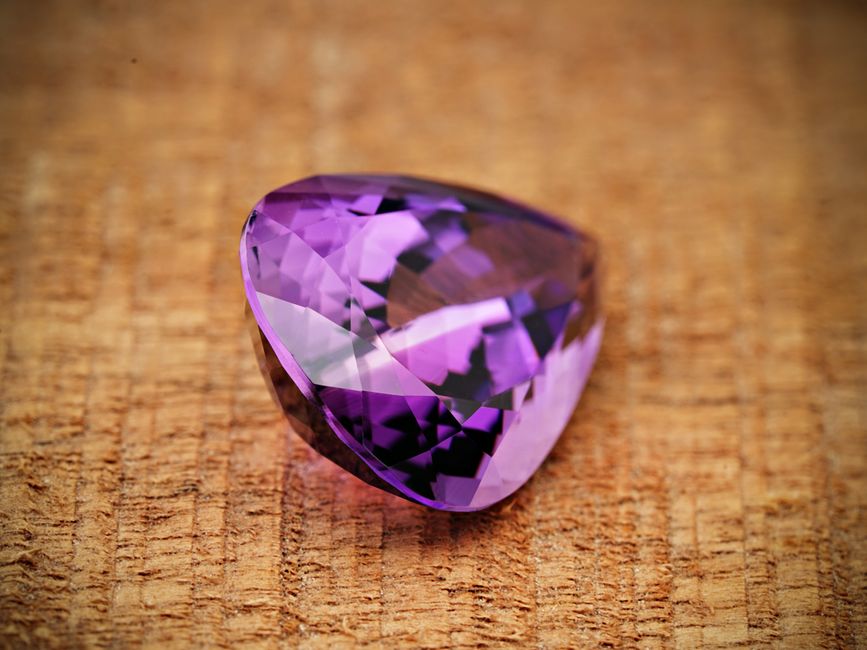 Iron, Radiation, and the Violet Lattice: How Defect Chemistry Determines Amethyst Color
