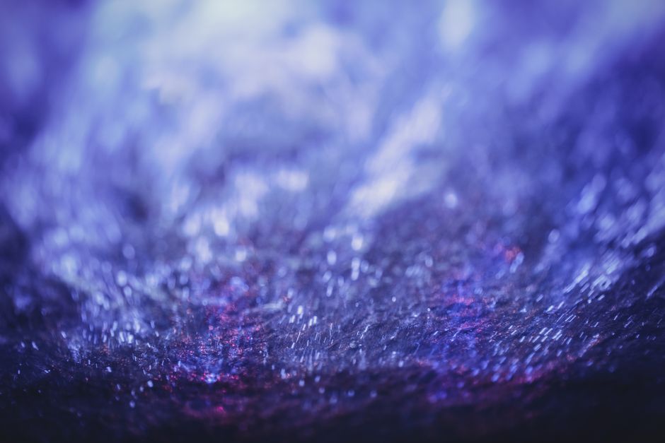 How Irradiation Colors Topaz: Distinguishing Trapped-Charge Defects from Trace-Element Chromophores