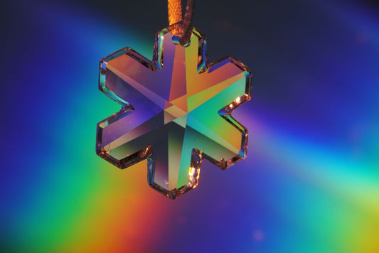 When Garnet Bends the Rules: Strain, Anisotropy, and the Optics of a Strained Cubic Crystal