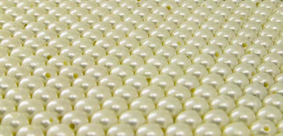 The Myth of Natural Pearl Luster: Separating Nacre from Iridescence in Optical Phenomena