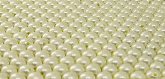The Myth of Natural Pearl Luster: Separating Nacre from Iridescence in Optical Phenomena