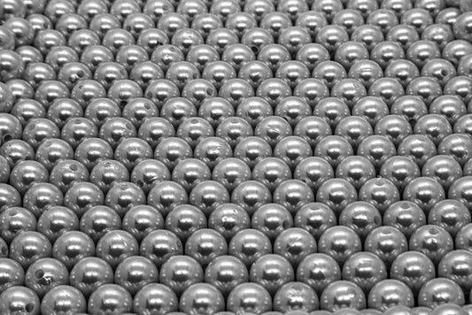 Directional Structure in Tahitian Pearls: Reading Growth and Exsolution Textures