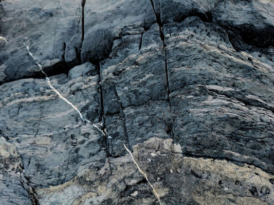 Grandidierite Formation: A Case Study of Pegmatite and Metamorphic Origins