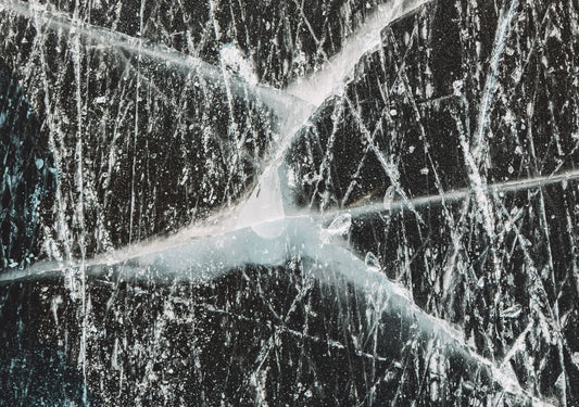 When Hardness Misleads: Synthetic Sapphire, Fracture Mechanics, and the Limits of Scratch Testing